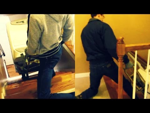 Moving out - taking the washing machine and dryer down the stairs on a hand truck