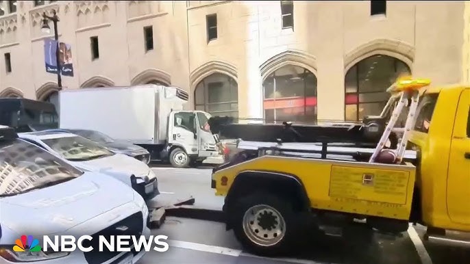 Video Shows Truck Trying To Tow Car With Driver Inside