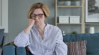 Sad Old Woman Sitting on Sofa | Stock Footage - Videohive