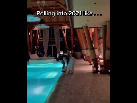 Girl tries to push other girl in the pool, and falls in herself.