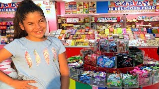 Annie pretends to play as candy maker toy store