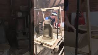 Gabriel cutting into a hedgehog house pot