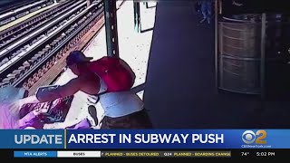Man arrested after woman thrown onto subway tracks