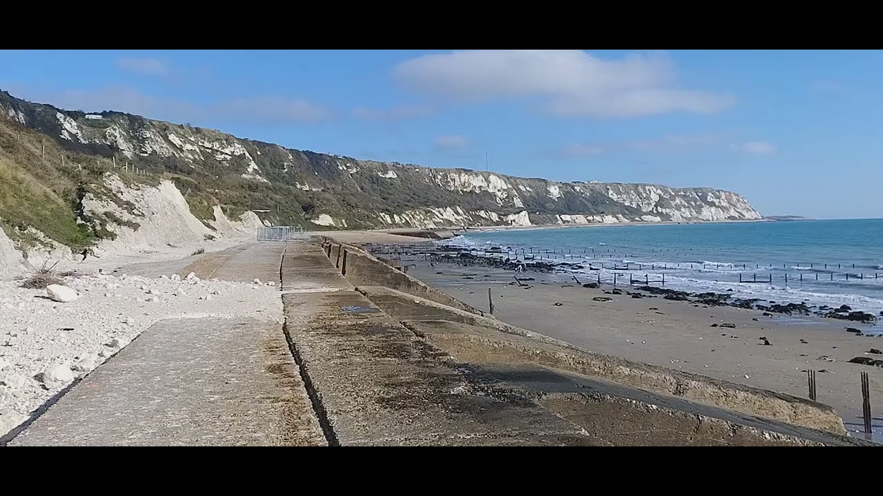 Beach view of East Cliff and Warren Country Park