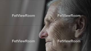 Close-up face of sad old woman with deep wrinkles