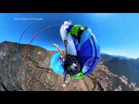 Paraglider nearly falls to death after parachute tangles in air: VIDEO
