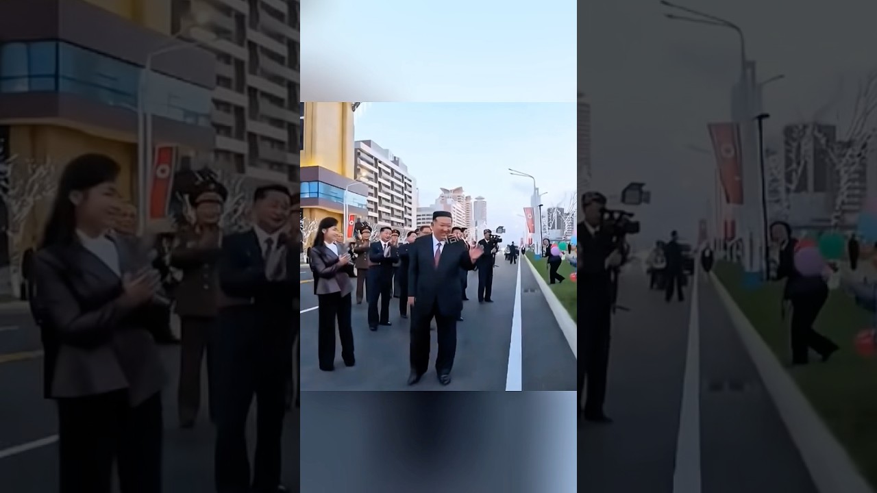 Chairman Kim Jong Un welcomes the first residents of the housing complex 