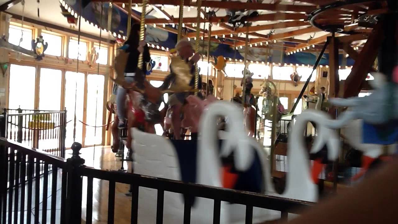 Stella & Levi on historic carousel in Nederland, CO.