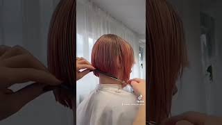 Bob haircut with undercut and fringe