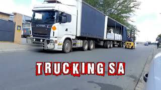 Scania With Superlink Tautliner Offloading Cargo