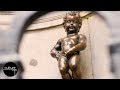 Manneken Pis - The Peeing Statue In The Centre Of Brussels