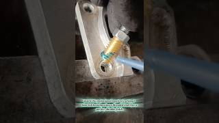 Professional Mechanic Repairing Stripped Threads On Metal Housing