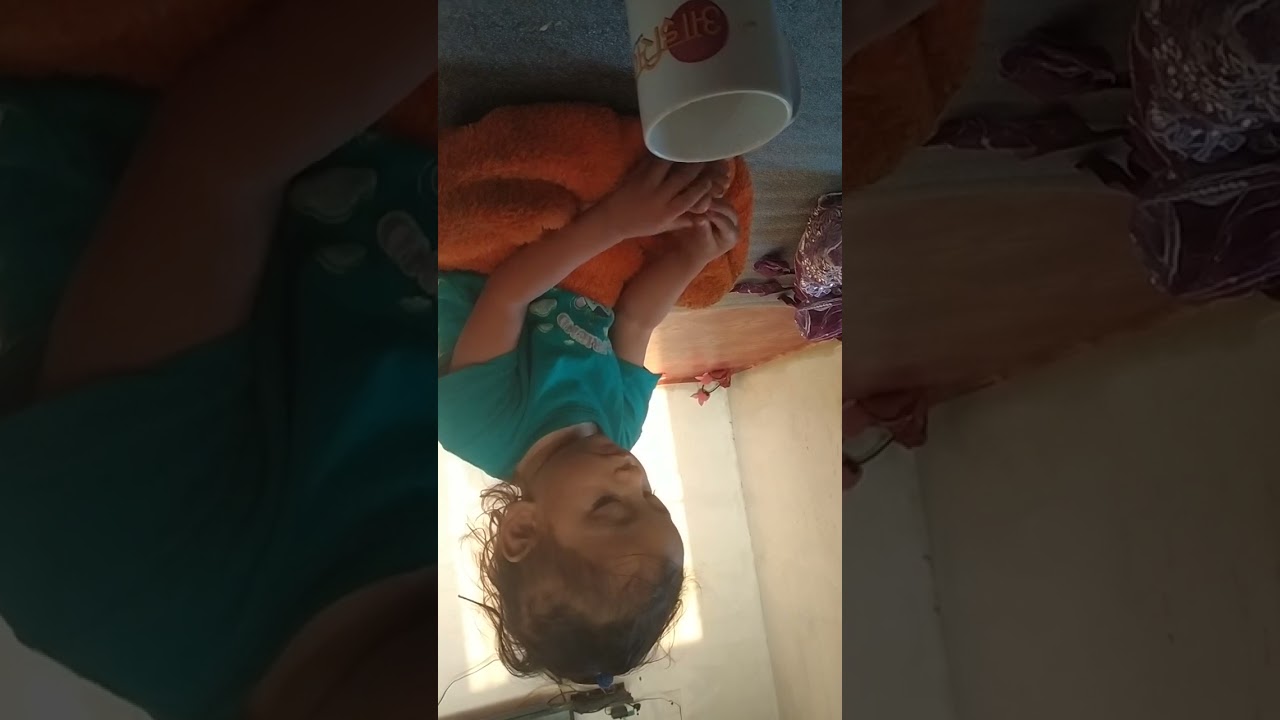 baby playing with cup 