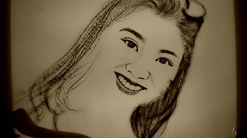 Vẽ tranh cát động chân dung