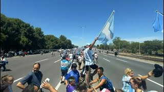 Fans wait for Argentina team bus on its way to victory parade | AFP