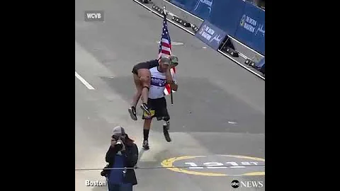 Man with prosthetic leg carries woman across Boston Marathon finish line