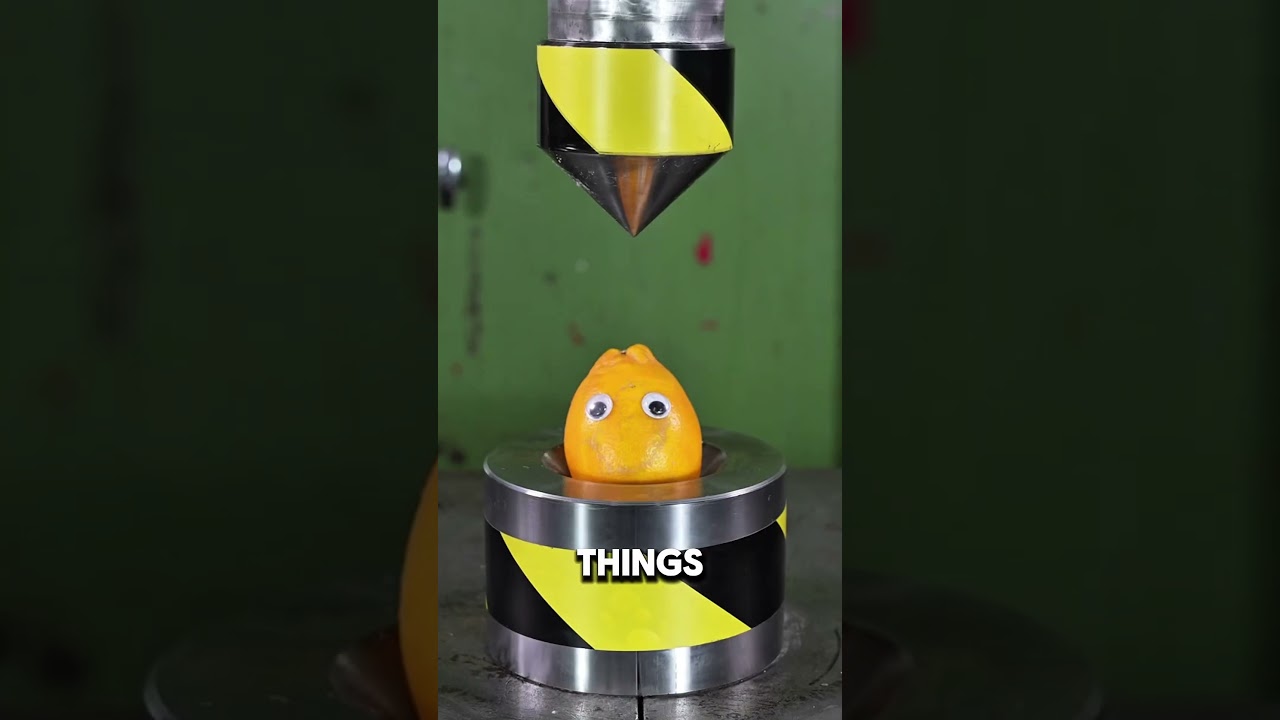 Fruit in a hydraulic press 