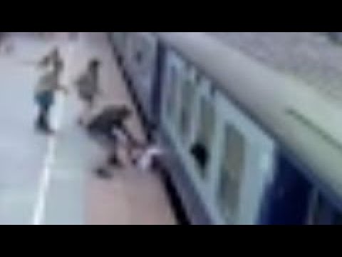 Indian man nearly pulled underneath moving passenger train