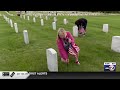 Hundreds place flags at Central Wisconsin Veterans Memorial Cemetery for Memorial Day