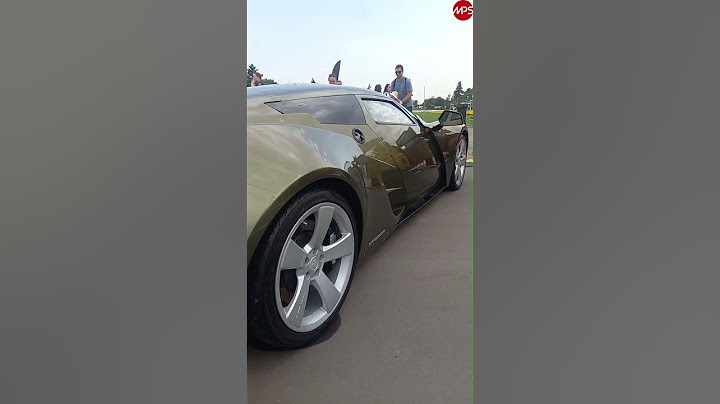 Marussia B2 didn't go ten years ago - but it's drawing crowds now? Russian supercar on the streets.