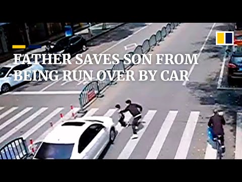 At last minute, father saves son from being run over by car in China