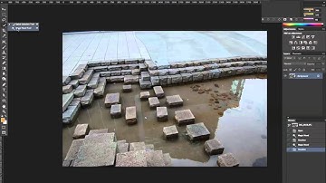 Selecting the magic wand tool at 100 tolerance in Photoshop