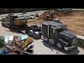 hauling CAT excavator, RGN lowboy trucking | Kenworth with LOUD JAKES