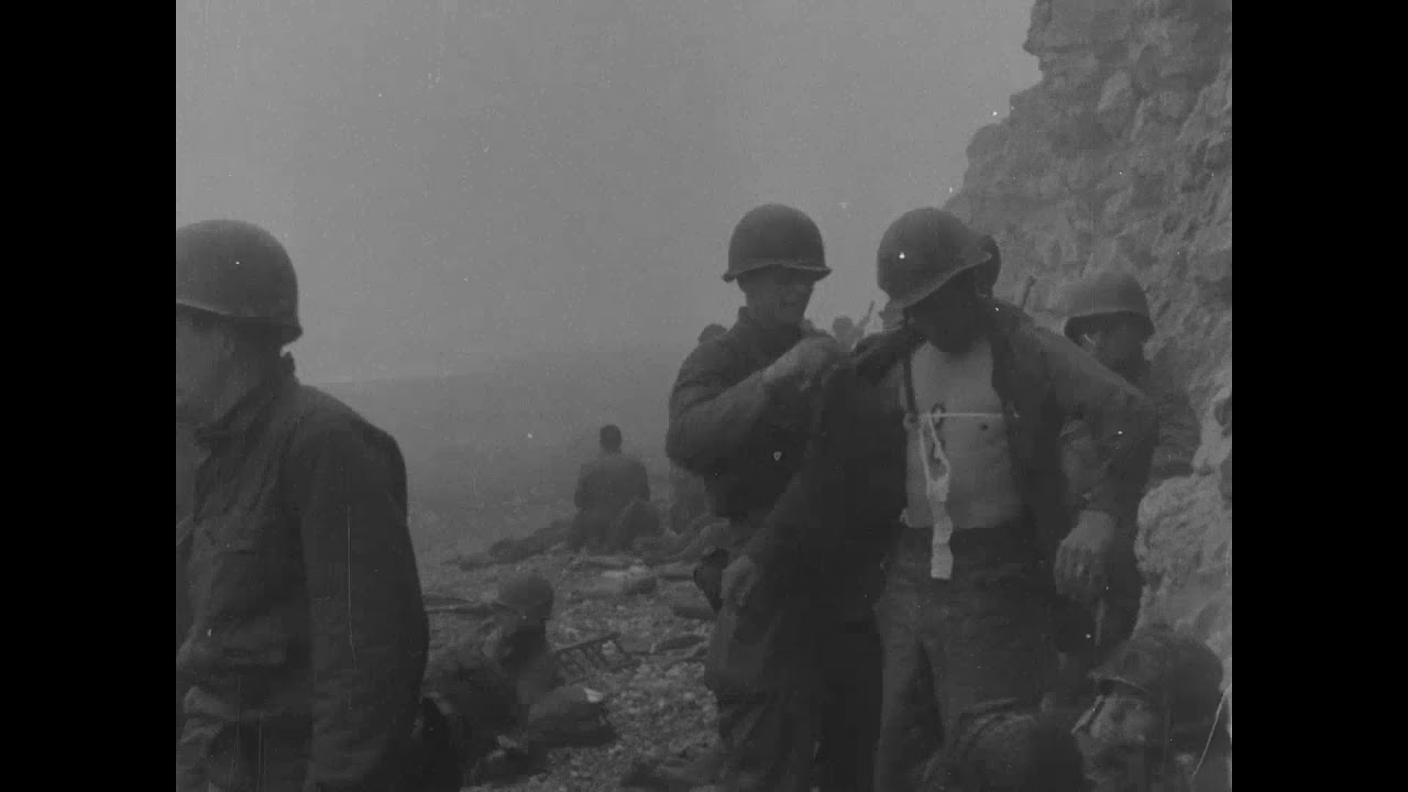 Dramatic combat footage showing US troops landing on OMAHA BEACH early