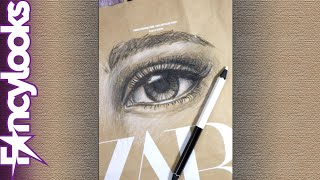 Dibujo un ojo realista en una bolsa de Zara