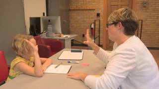 Emily Tonti teaches phonics lessons with a severely dyslexic child