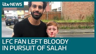 Liverpool fan meets hero Mo Salah after running into lamppost | ITV News