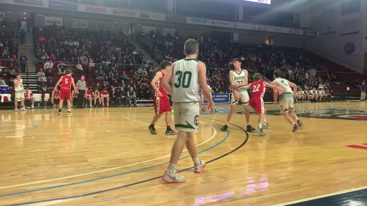 Bryce Valcourt hits a shot at the buzzer to give Fort Kent a 22-15 lead going into the half