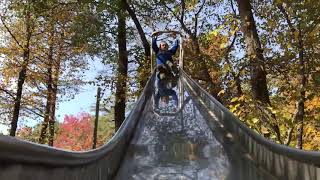 Kid on old metal slide with wax paper