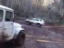 Toyota FJ40 with nice fat V8 spinning up some mud, 1985 4Runner trying the same, then a new Prado about to go in for 30000KM service gives it a go, and finally a Brand New Pajero gets hamstrung by technology, cannot spin wheels for love nor money