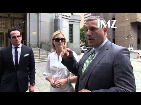 Michael Wildes and Client Kelly Rutherford leaving Federal Court