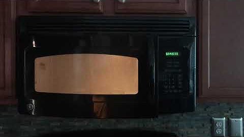 Footage of GE microwave model JNM1541DN1BB saying “keypad shorted — service may be needed”