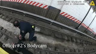 NYPD officers save woman who fell onto subway tracks