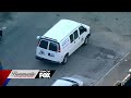 A HIGH SCHOOL STUDENT WAS SHOT BY 2 MASKED ROBBERS AT HIS BUS STOP