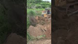 Bulldozer pushing Clearing Dirt