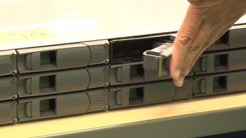 Lenovo ThinkStsyem DE Series 2U enclosure installing a drive