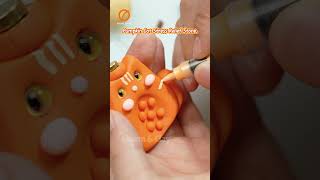 Spin & Smile 😸🍊 #charmnclay#diy#custommade#tutorial#worrystone#handmade#fidgettoys #smallbusiness