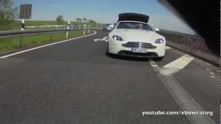 Aston Martin Vantage V8 Roadster opening roof while driving