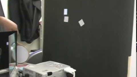 Projector-based Tracking System with Retro-reflective Material