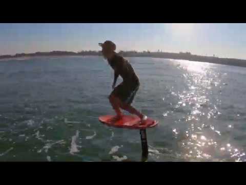 Surf foiling novelty waves in Harbour - YouTube