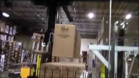 Robotic Depalletizer with Covered Decline Conveyor