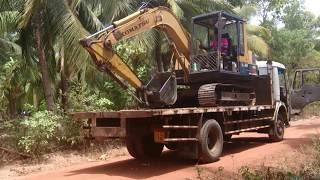 Loading of an Excavator on to a truck without a ramp