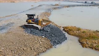 Nice Techniques Build Road on Water with Operator Bulldozer Pushing Stone and Truck Unloading Stone