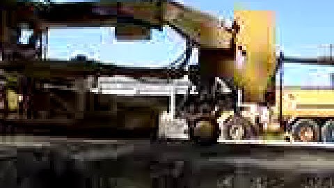 Loading a Cat 140H Motor Grader into a 40 ft. Sea Container--Part 1