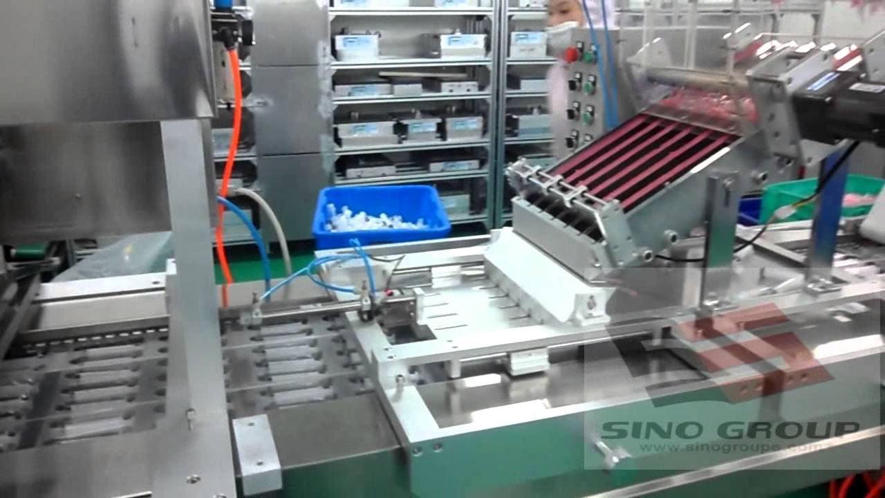 Syringe assembling production line - YouTube