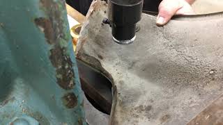 Using the arbor press and a selection of dies from Pat Brubaker to remove a dent from a 2002 front fender.